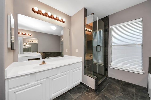 bathroom featuring a stall shower and vanity