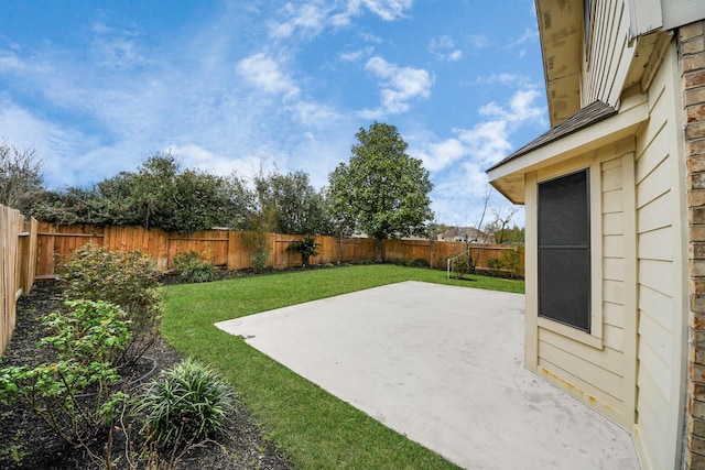 view of yard with a patio and a fenced backyard