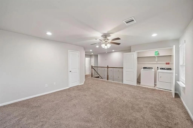 carpeted spare room featuring recessed lighting, visible vents, independent washer and dryer, and baseboards