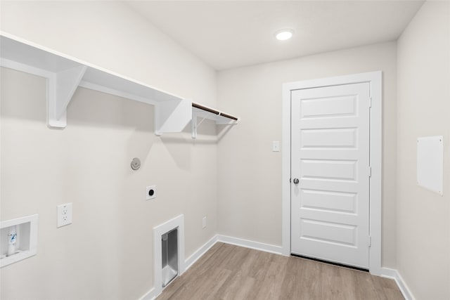 laundry room with baseboards, laundry area, light wood-style flooring, electric dryer hookup, and washer hookup