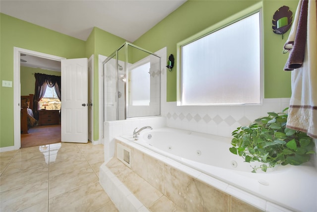 ensuite bathroom featuring tile patterned floors, connected bathroom, a stall shower, and a whirlpool tub