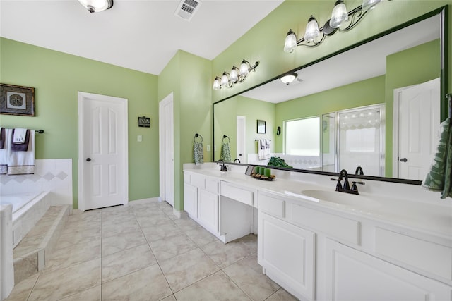 full bathroom featuring visible vents, a stall shower, a sink, tile patterned flooring, and double vanity