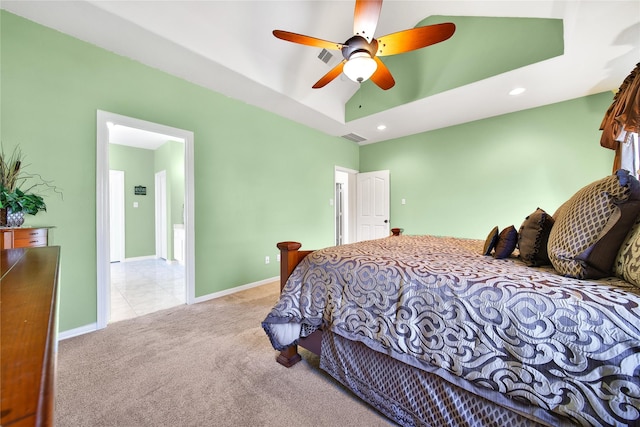 carpeted bedroom with recessed lighting, baseboards, a raised ceiling, and ceiling fan