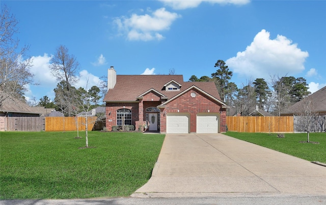 view of front facade with brick siding, a front lawn, fence, concrete driveway, and a chimney