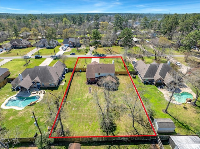 aerial view with a residential view and a wooded view