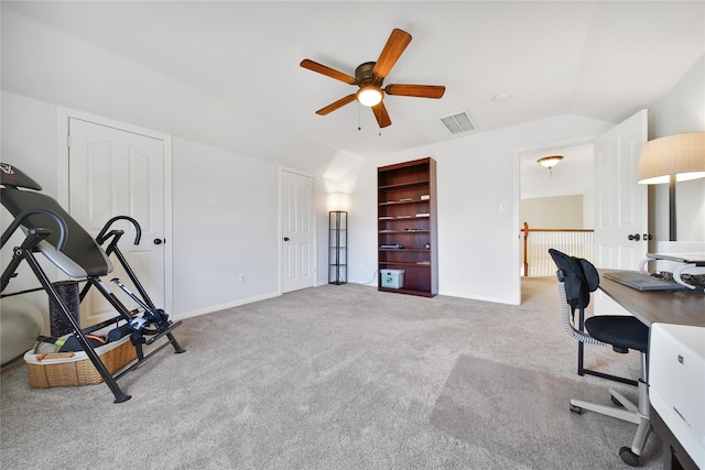 carpeted office featuring visible vents, baseboards, ceiling fan, and vaulted ceiling