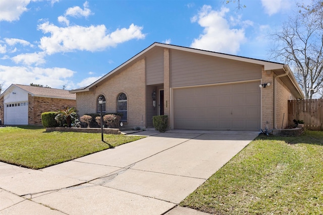 view of front of property featuring a front lawn, a garage, brick siding, and driveway