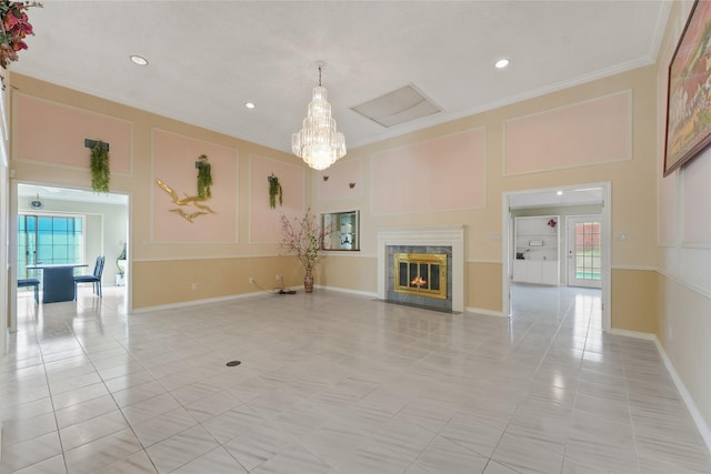 unfurnished living room with crown molding, plenty of natural light, light tile patterned floors, and a premium fireplace