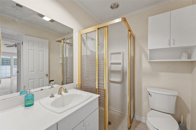 bathroom featuring vanity, a shower stall, toilet, and visible vents