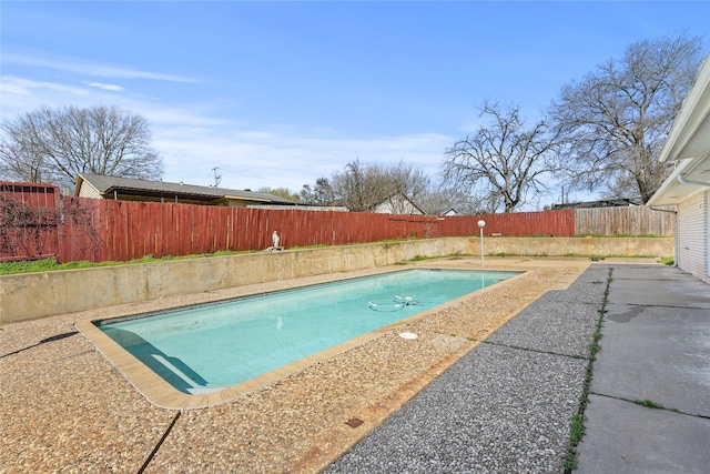 view of pool with a fenced in pool, a patio, and a fenced backyard