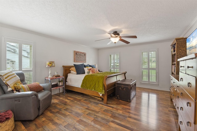 bedroom featuring crown molding, a textured ceiling, dark wood-type flooring, and a ceiling fan