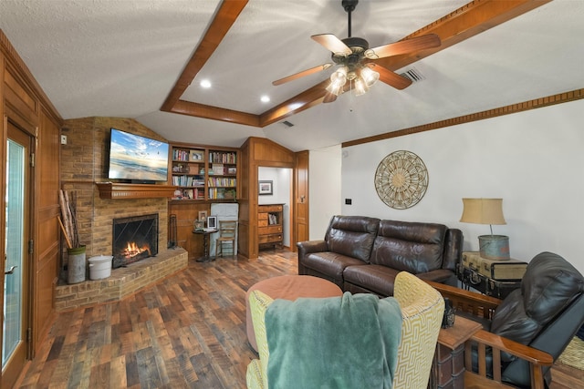 living room with visible vents, a brick fireplace, dark wood finished floors, vaulted ceiling, and a textured ceiling