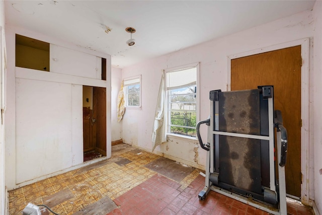 interior space featuring brick floor