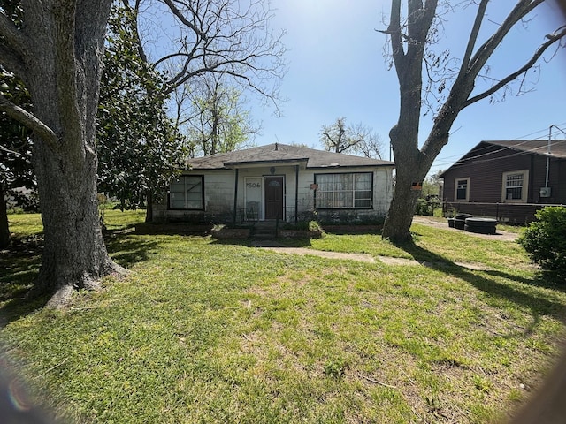 bungalow with a front yard