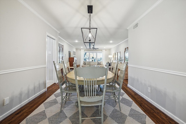 dining area featuring recessed lighting, ornamental molding, visible vents, and wood finished floors