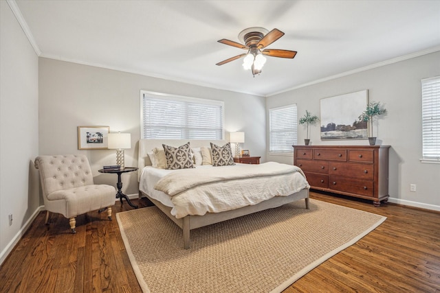 bedroom featuring baseboards, a ceiling fan, dark wood-style flooring, and crown molding