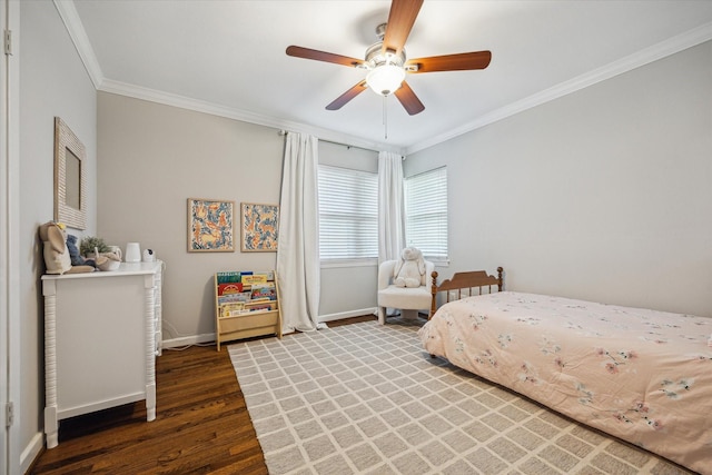 bedroom with ceiling fan, crown molding, baseboards, and wood finished floors