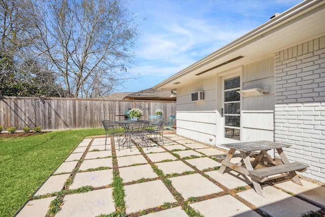 view of patio / terrace with outdoor dining space and fence