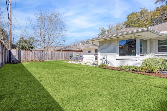 view of yard with a fenced backyard and a patio