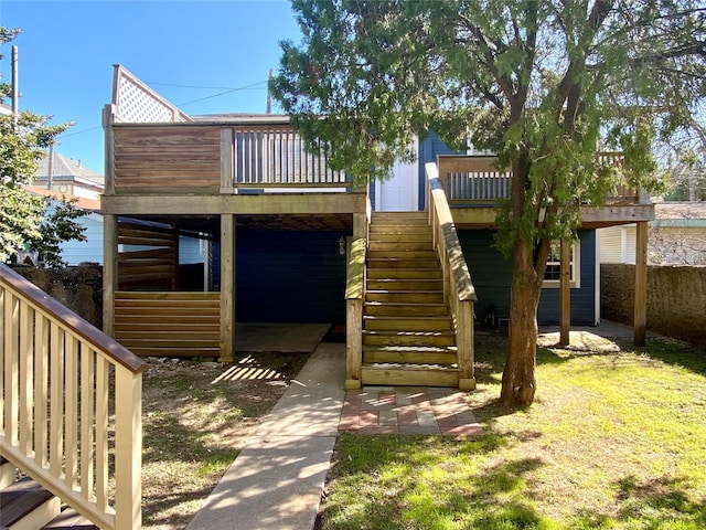 exterior space featuring a wooden deck and stairs