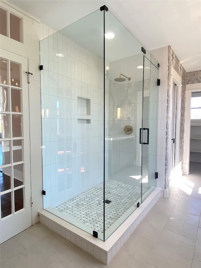 bathroom featuring a shower stall and tile patterned flooring