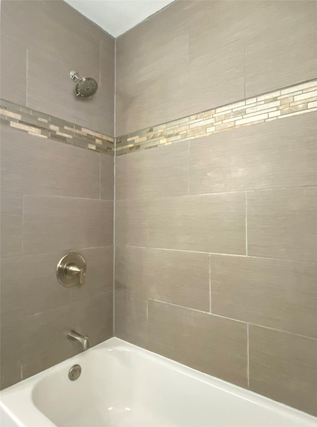 full bath with bathing tub / shower combination