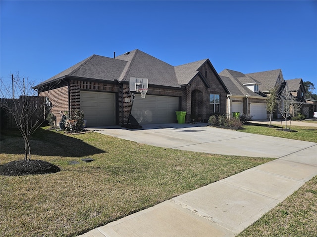 view of front of property featuring a front lawn, a garage, brick siding, and driveway