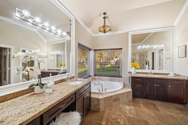 full bathroom featuring a sink, a stall shower, a bath, and crown molding