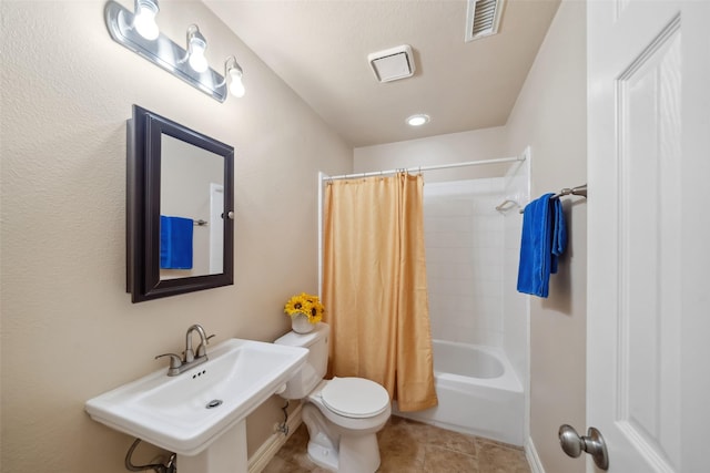 bathroom with visible vents, shower / bath combo with shower curtain, toilet, a sink, and tile patterned flooring