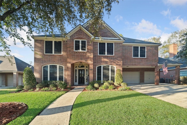 view of front facade featuring concrete driveway, an attached garage, brick siding, and a front lawn