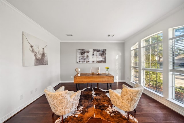 office featuring visible vents, ornamental molding, baseboards, and wood finished floors