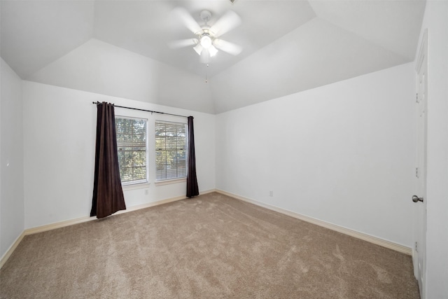 empty room with baseboards, carpet floors, a ceiling fan, and vaulted ceiling