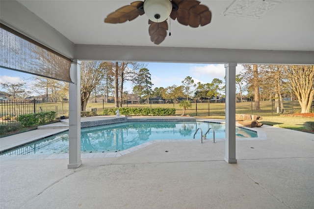 view of pool with ceiling fan, a fenced in pool, a patio, and a fenced backyard