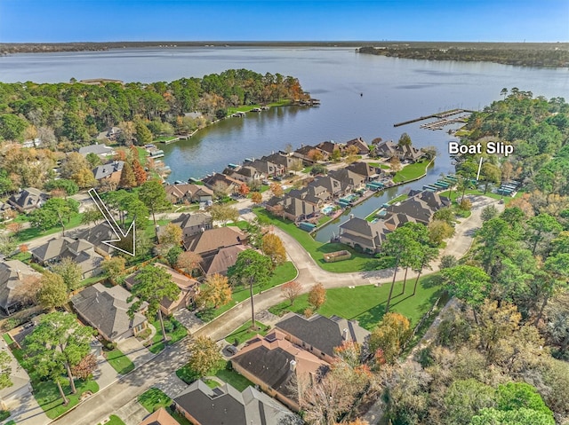 drone / aerial view featuring a residential view and a water view