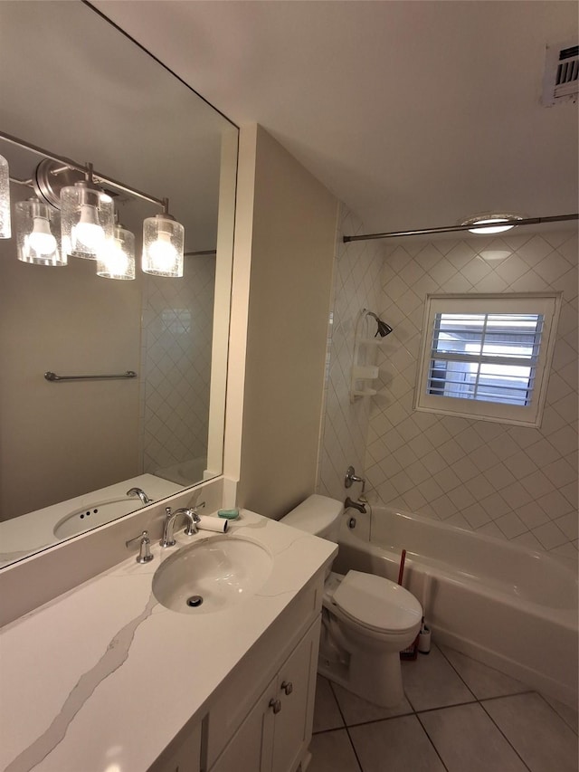 bathroom featuring vanity, washtub / shower combination, visible vents, tile patterned floors, and toilet