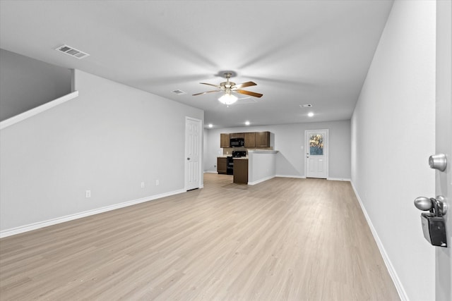 unfurnished living room featuring a ceiling fan, light wood-style flooring, baseboards, and visible vents