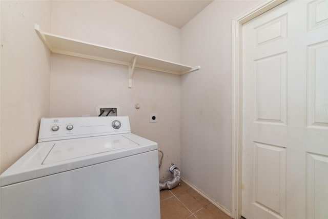 laundry area with washer / dryer, light tile patterned floors, and laundry area