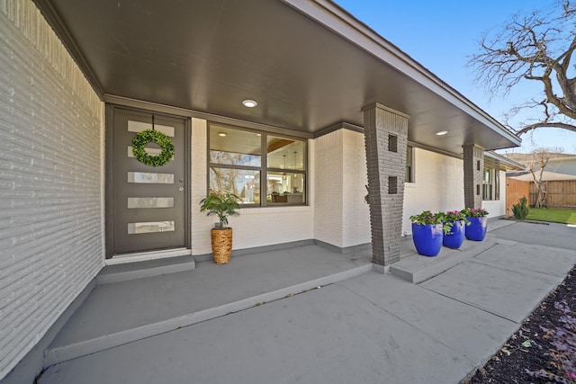 property entrance with brick siding