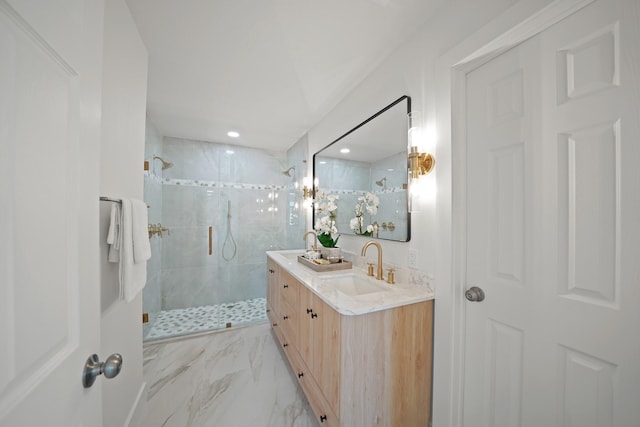 full bathroom featuring a marble finish shower, marble finish floor, and vanity