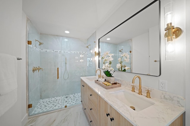 full bath with double vanity, recessed lighting, a stall shower, and a sink