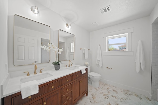 full bath with double vanity, visible vents, toilet, and a sink