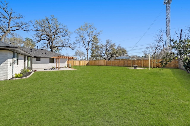 view of yard featuring a patio area and a fenced backyard