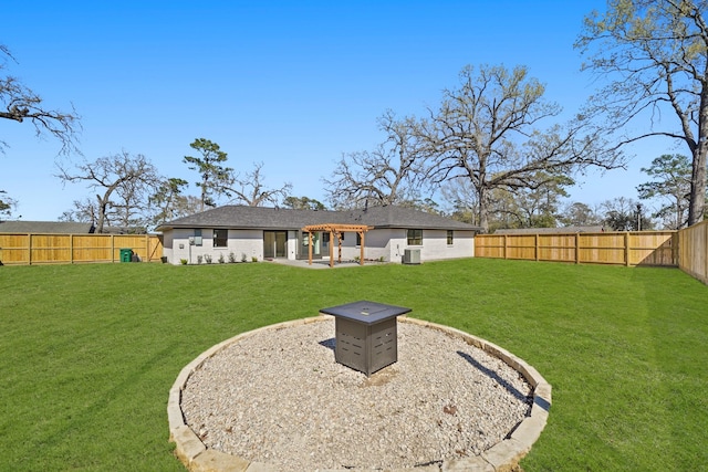 back of house featuring a patio, a lawn, and a fenced backyard