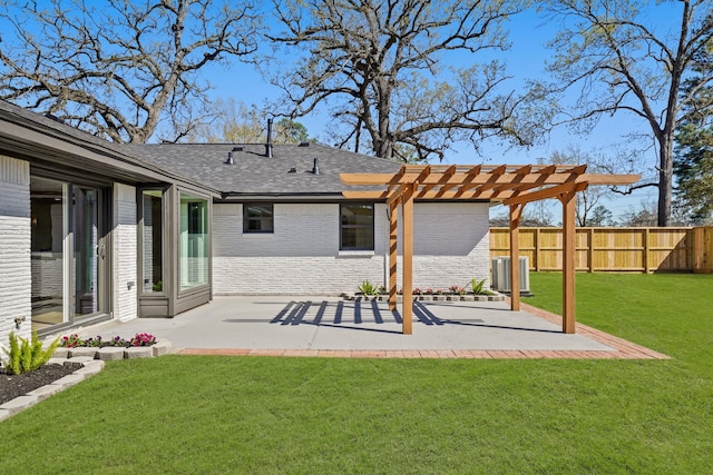 back of property featuring fence, a pergola, a patio area, a lawn, and brick siding