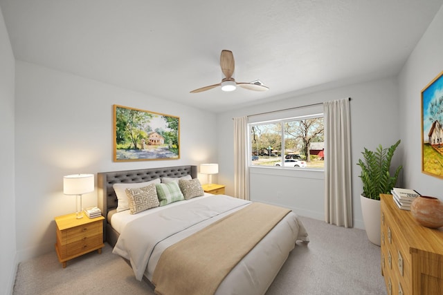 bedroom with baseboards, light colored carpet, and ceiling fan