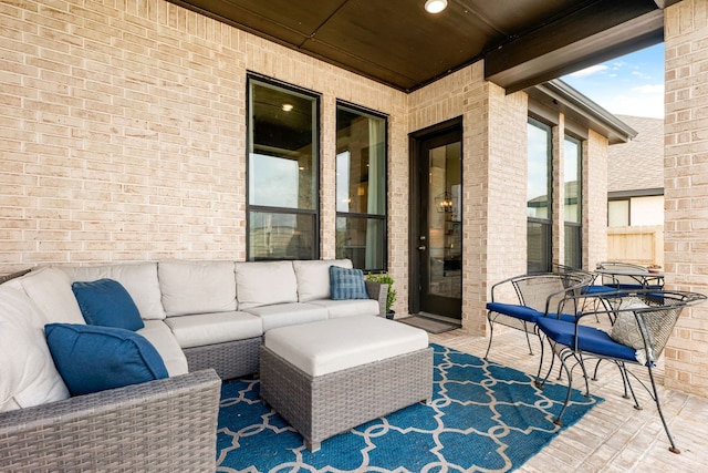 view of patio with outdoor lounge area and fence