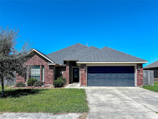 ranch-style home featuring roof with shingles, concrete driveway, a front lawn, a garage, and brick siding