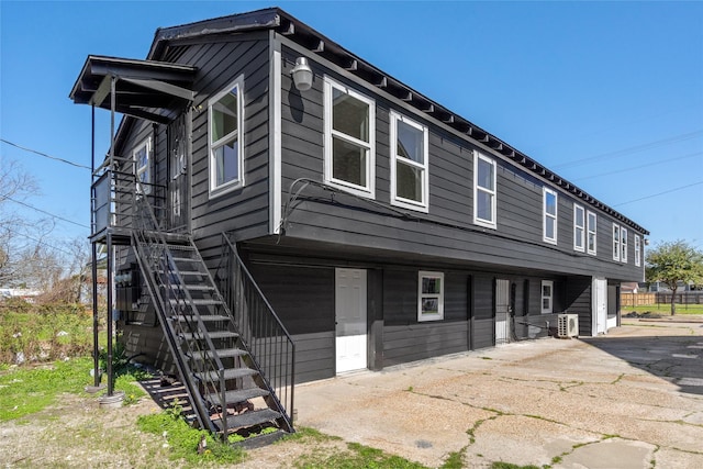 view of front of house featuring stairway