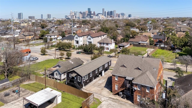 birds eye view of property with a view of city