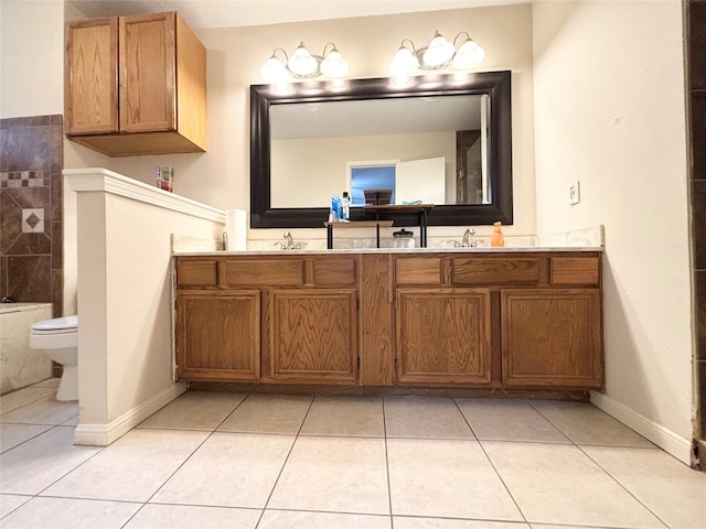 full bathroom featuring a sink, toilet, double vanity, and tile patterned flooring